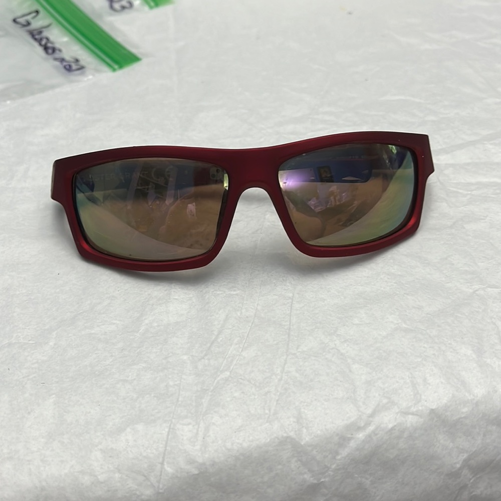 Gently used FOSTER GRANT red/maroon rubberized athletic sunglasses